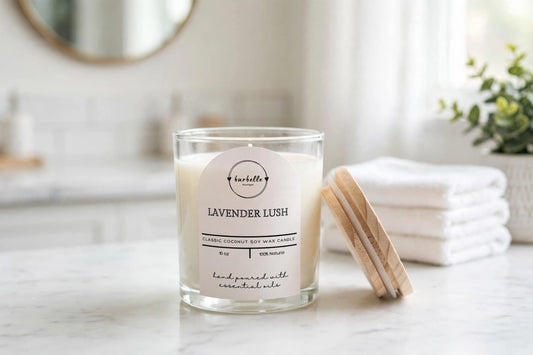 CLASSIC Lavender Lush coconut soy wax candle 10 oz clear glass jar with lid resting beside it on a bright marble bathroom vanity